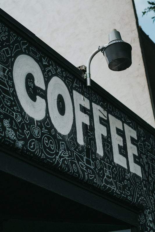 coffee painted on the black wall
