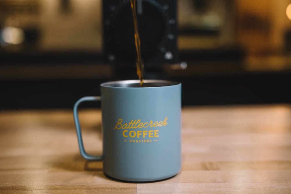 blue ceramic mug with coffee