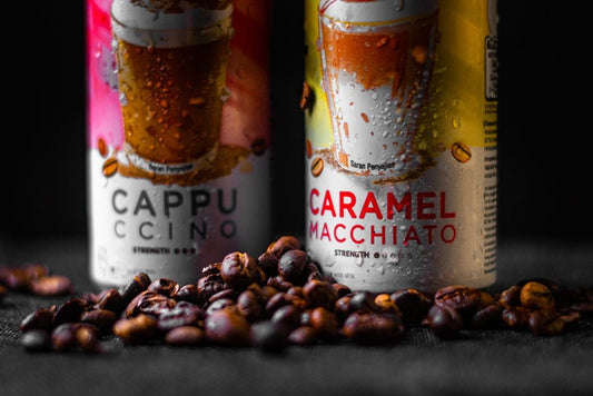 two cans of caramel macchiato on a table