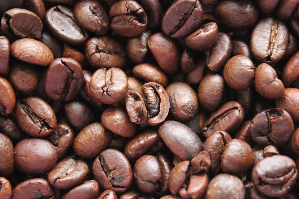 a pile of coffee beans that are brown