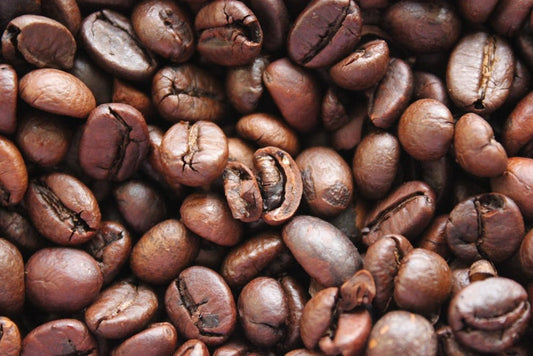 a pile of coffee beans that are brown
