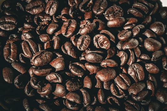 a pile of coffee beans sitting on top of a table