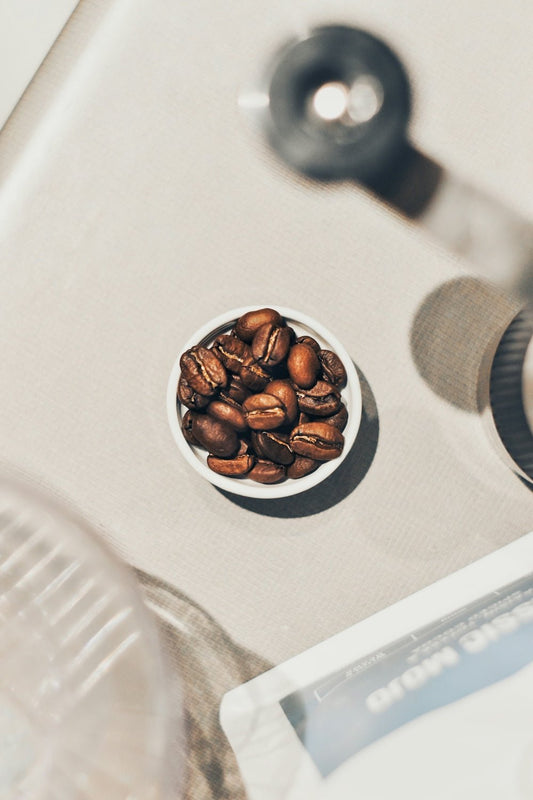 a bowl of nuts sitting on top of a table