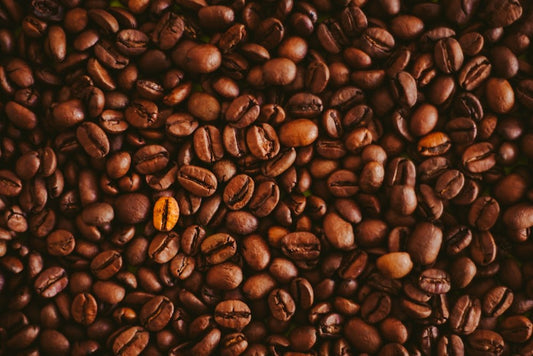 A pile of coffee beans sitting on top of each other