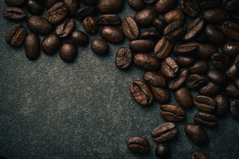 A pile of coffee beans sitting on top of a table