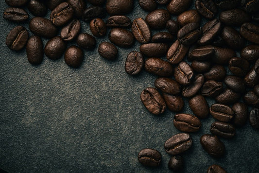 A pile of coffee beans sitting on top of a table