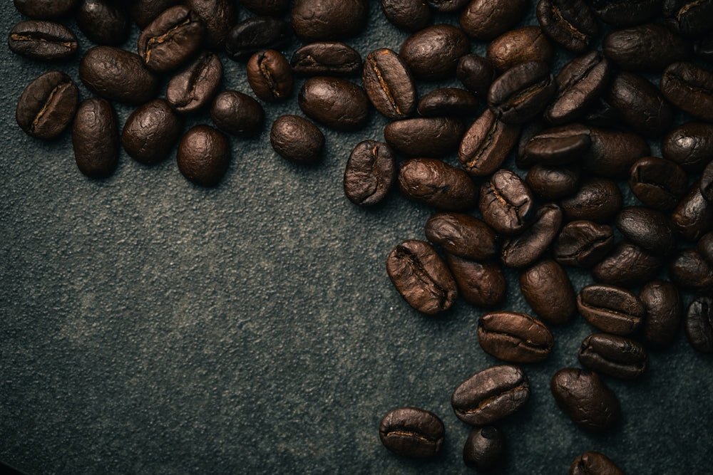 A pile of coffee beans sitting on top of a table
