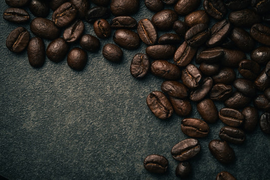 A pile of coffee beans sitting on top of a table