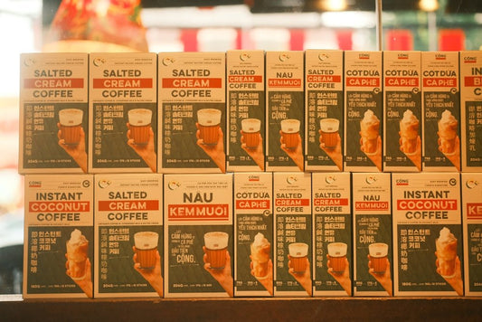 Boxes of instant coffee and coconut drinks displayed on shelf
