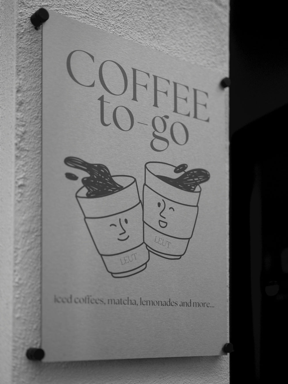 Coffee to-go sign with cartoon cups
